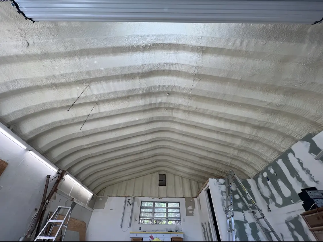 Spray polyurethane foam applied to the underside of a metal roof deck in Burnsville